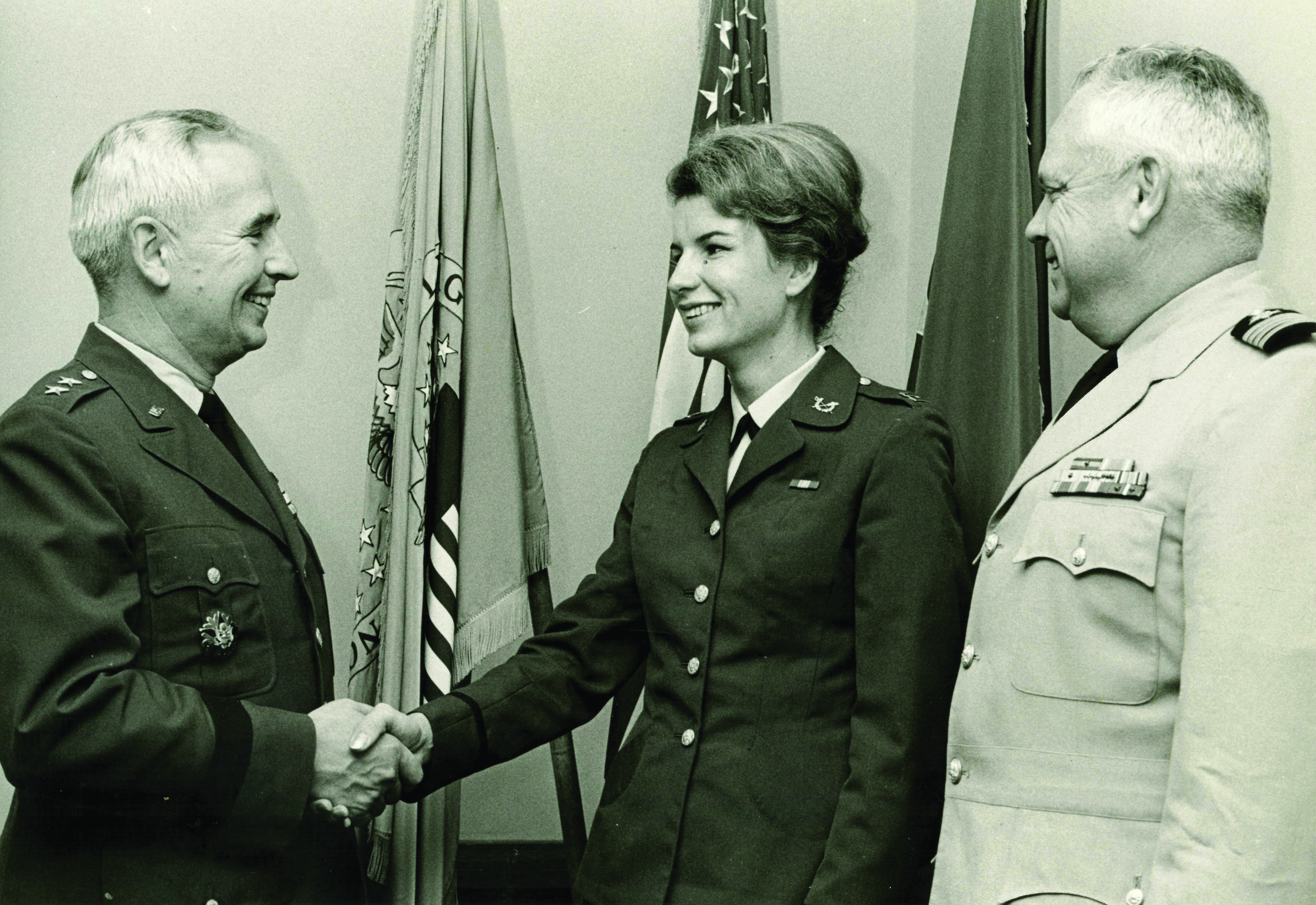 Captain Nancy Hunter’s inter-service transfer from the Navy to the Army is unique in JAG Corps history. In this
        photograph, taken in 1967, she wears an Army uniform and crossed-sword-and-pen insignia for the first time.
        (Photo courtesy of author)